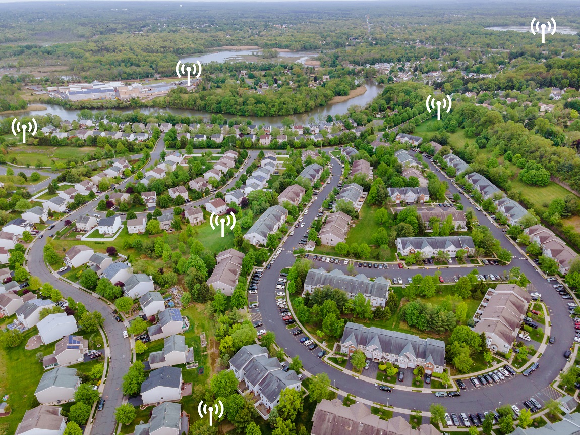 Aerial top view of small town urban landscape roofs of neighborhood with houses